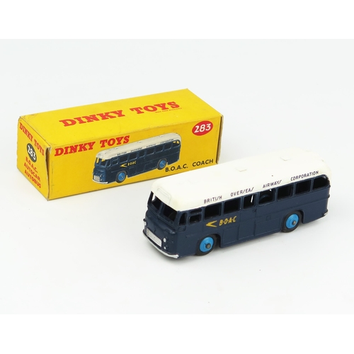 2279 - A Dinky 283 BOAC Coach in dark blue/white with blue hubs and black smooth tyres. Near mint in excell... 