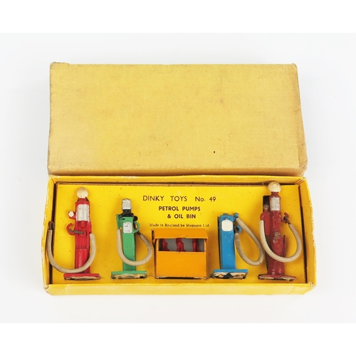 2291 - A Dinky Toys 49 Petrol Pumps & Oil Bins with white rubber hoses in yellow non-picture box. Excellent... 