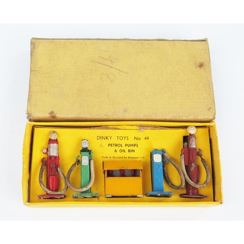 2292 - A Dinky Toys 49 Petrol Pumps & Oil Bins with white rubber hoses in yellow non-picture box. Good with... 