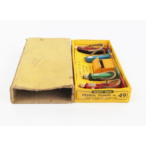 2292 - A Dinky Toys 49 Petrol Pumps & Oil Bins with white rubber hoses in yellow non-picture box. Good with... 