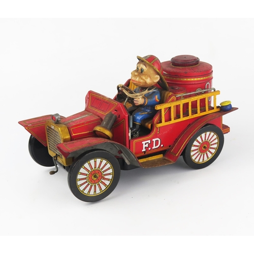 2557 - A 1960's TN Toys Nomura Tinplate Battery Operated Fire Engine, untested and incomplete