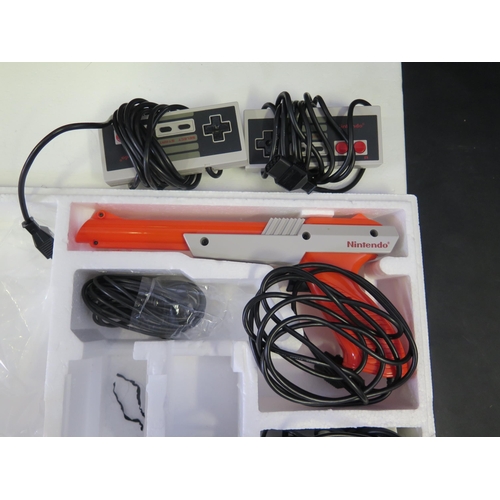 2604 - Nintendo NES Entertainment System Action Set - comes with orange zapper, two controllers, and Mario ... 