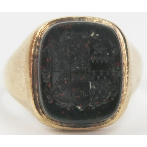 30 - 9ct Gold and Bloodstone Double Sided Signet Ring decorated with a coat of arms obverse and lion abov... 
