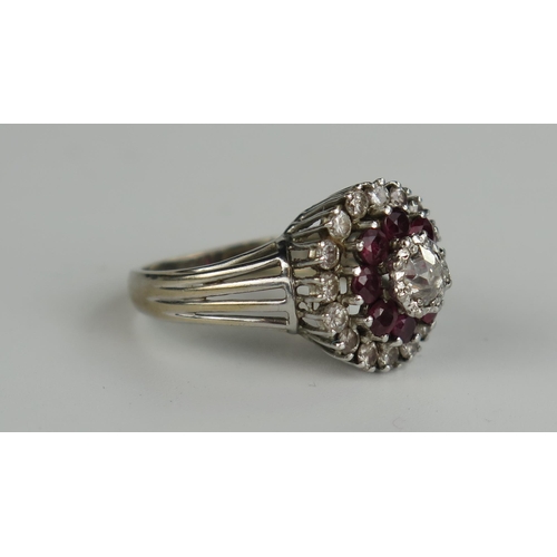 400 - Diamond and Ruby Cluster Ring, central stone 50PT surrounded by 8 rubies and further 16 10PT diamond... 