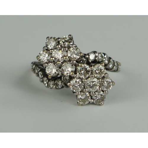 402 - 18ct White Gold and Diamond Double Cluster Cross Over Ring, set with 14 1.5mm brilliant cut stones a... 