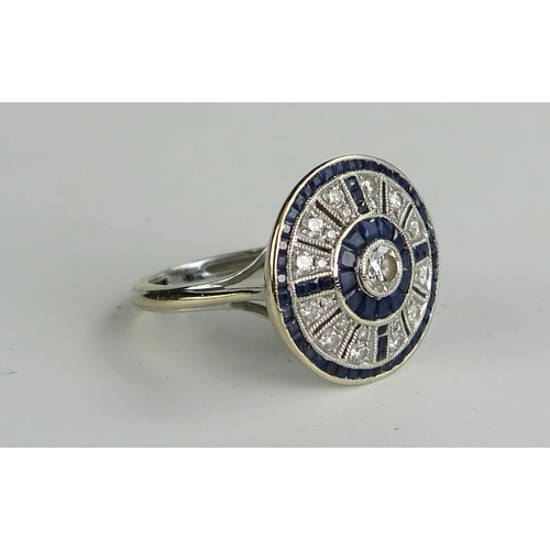 415 - 18ct White Gold, Sapphire and Diamond Shield Ring, 17.5mm head, size L.75, 5.4g