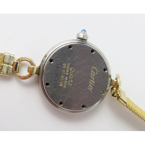 436b - Cartier Ladies Wristwatch, 23.5mm steel and gold case with cabochon sapphire set crown, back marked ... 