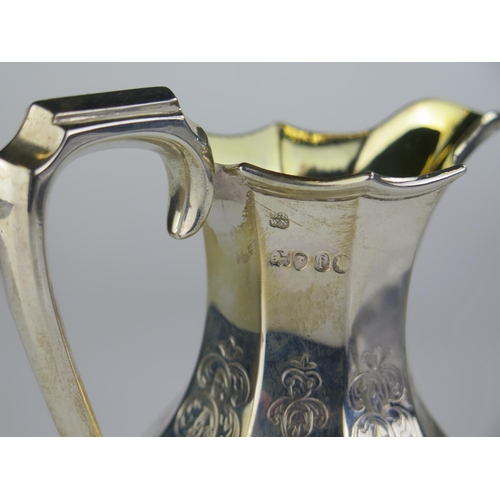 665 - Victorian Silver Milk Jug with chased figural and foliate decoration and gilt lined interior, 13cm h... 