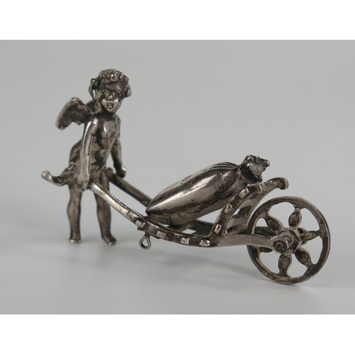 701 - 19th Century Continental Silver Cupid bearing a sack barrow, sack marked 1000, 62mm long, 27.8g