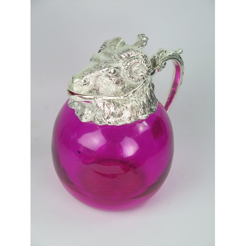 747 - A Pink Glass Decanter with Silver Plated Ram's Head Mount, 19cm high