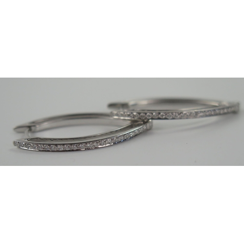 76 - A Pair of 18ct White Gold and Diamond Earrings, 32 mm long, 6.7 g

Sold on behalf of the following c... 