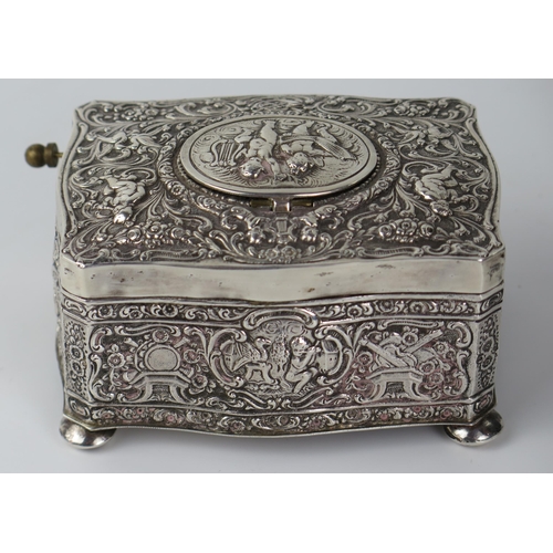 765 - Silver Bird Box Automaton with embossed putti and foliate decoration, c. 11(w)x6(h)x8(d)cm