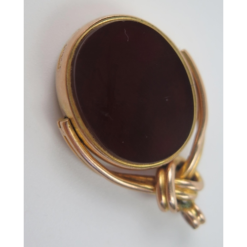 82 - Antique 9ct Gold Spinning Fob set with agate, 34mm drop, Birmingham 1909, 8.4g