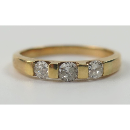 83 - 18ct Gold and Diamond Three Stone Ring, central stone c. 3.5mm and flanked by 3.2mm, size P, 2.9g