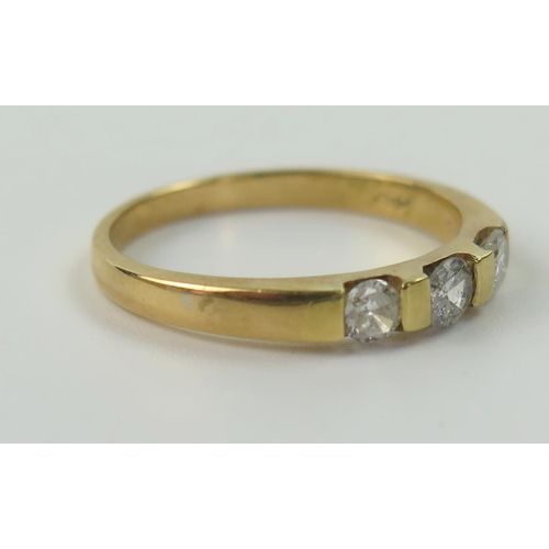 83 - 18ct Gold and Diamond Three Stone Ring, central stone c. 3.5mm and flanked by 3.2mm, size P, 2.9g