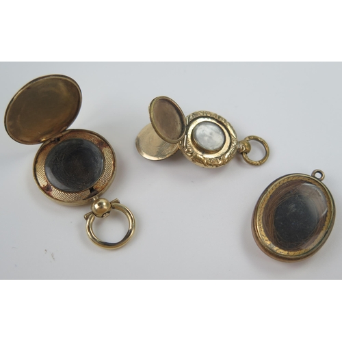 145 - Three 19th Century Gold Plated Memorial Fobs, largest 22mm diam. with hair, smaller with twin hinged... 