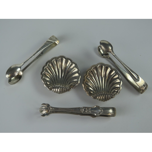 510 - A Pair of Continental Silver Scallop Shaped Silver Salts and three sterling silver sugar tongs, 80g