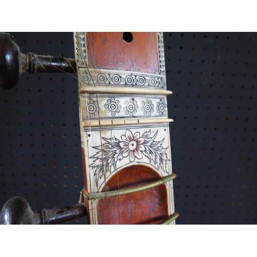 2710 - An Indian Sitar beautifully decorated with bone inlay and carvings - missing two tuning pegs