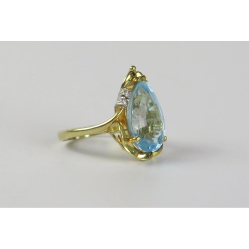 186 - 14ct Gold, Blue Topaz and Diamond Ring, the pear shaped central stone 10.7ct, size N.5, 8.3g, boxed