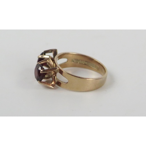 210b - 9cy Gold and Garnet Two Stone Ring, shank stamped FINLAND, sizeG, 2.7g