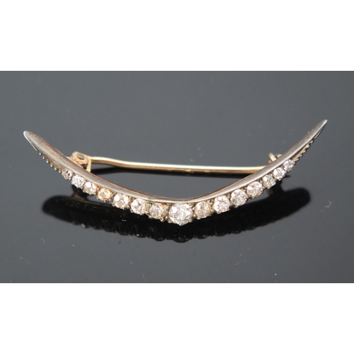 12 - Antique Diamond Crescent Brooch set with fifteen old cut stones, largest estimated at .15ct, 45.5mm ... 