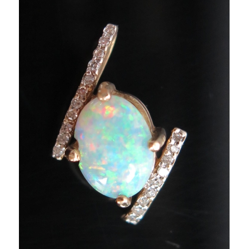 127 - 9ct Opal and Diamond Pendant, 18mm drop, 1.3g