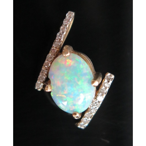 127 - 9ct Opal and Diamond Pendant, 18mm drop, 1.3g