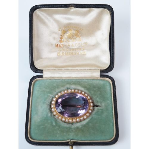 13 - Antique Amethyst and Pearl Brooch in an unmarked high carat gold millegrain setting, central stone 2... 