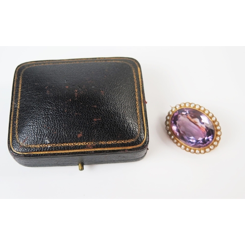 13 - Antique Amethyst and Pearl Brooch in an unmarked high carat gold millegrain setting, central stone 2... 