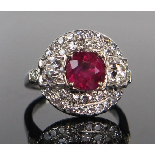 138 - Natural Burmese Ruby and Diamond Cluster Ring in a platinum setting. Sold with GCS certificate stati... 