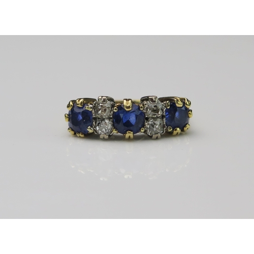 158 - 18ct Gold, Sapphire and Diamond Seven Stone Ring, sapphires c. 5.9mm with old cuts in the middle, si... 