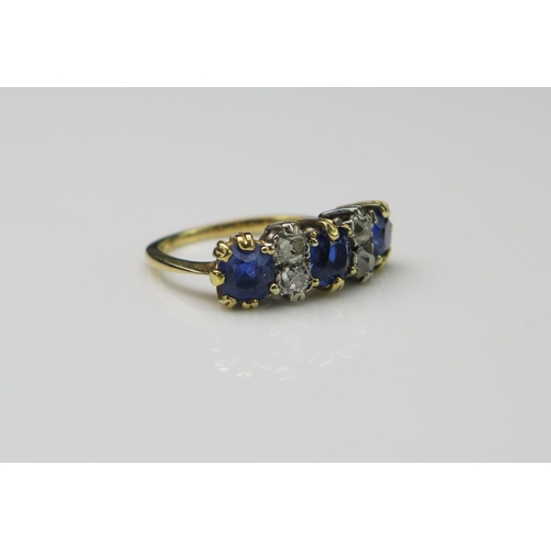 158 - 18ct Gold, Sapphire and Diamond Seven Stone Ring, sapphires c. 5.9mm with old cuts in the middle, si... 