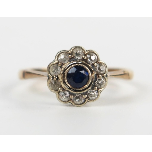 229 - Antique Sapphire and White Stone Cluster Ring in an unmarked gold setting, 9mm head, size K.25, 1.4g