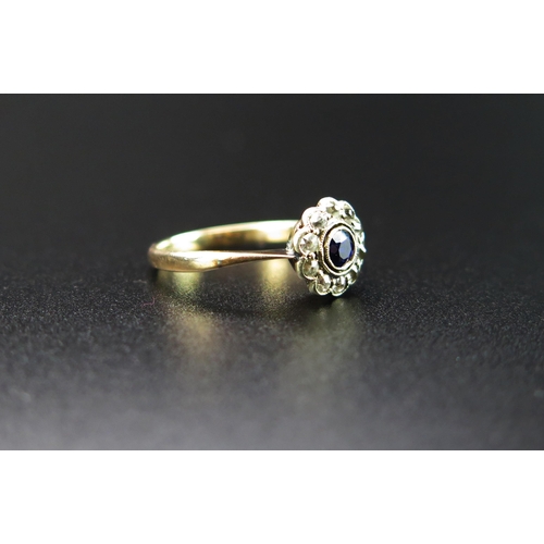 229 - Antique Sapphire and White Stone Cluster Ring in an unmarked gold setting, 9mm head, size K.25, 1.4g