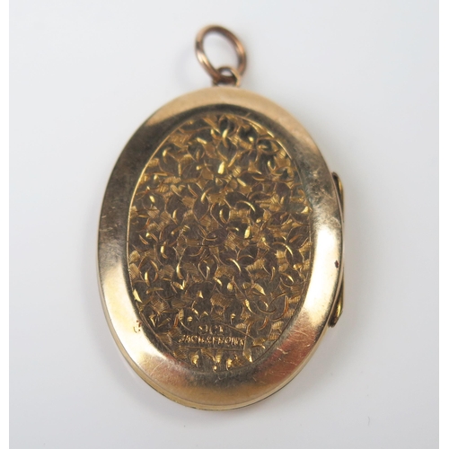 296 - 9ct Gold Back and Front Locket with chased foliate decoration and IC monogram, 39mm drop, 5.5g