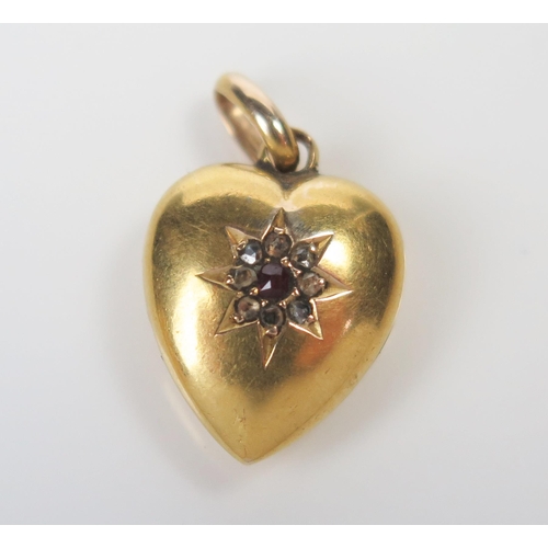 300 - 15ct Gold, Ruby and Rose Cut Diamond Heart Shaped Pendant, Chester marks, 22mm drop, 1.5g. Split to ... 