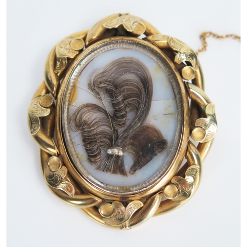 329 - Victorian Pinchbeck Memorial Brooch, the double sided swivel panel set with hair and pearl spray to ... 