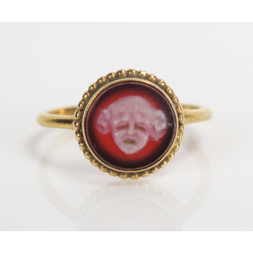 330 - Antique Tragedy Mask Hardstone Cameo Ring in an unmarked high carat gold setting, 12mm diam. head, s... 