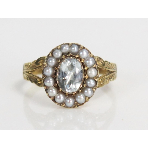 331 - Early Victorian Foil Backed Paste and Pearl Cluster Ring in an unmarked high carat gold setting with... 