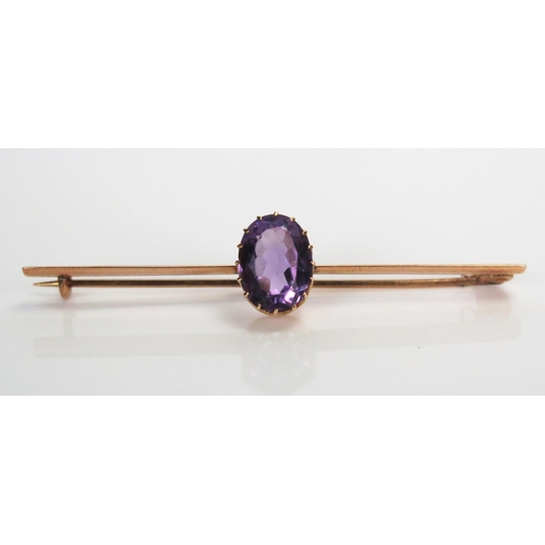 341 - 9ct Gold and Amethyst Bar Brooch, unmarked, 65mm wide, 4.4g