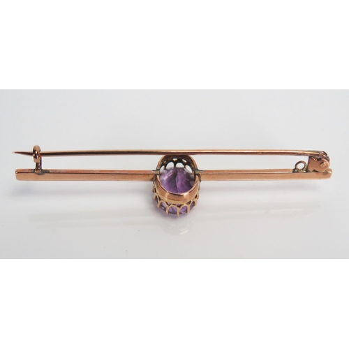 341 - 9ct Gold and Amethyst Bar Brooch, unmarked, 65mm wide, 4.4g