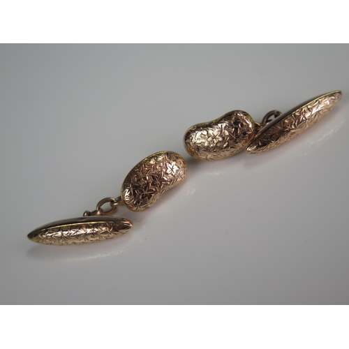 347 - Pair of 9ct Gold Cufflinks of kidney form with chased foliate decoration, 5.1g