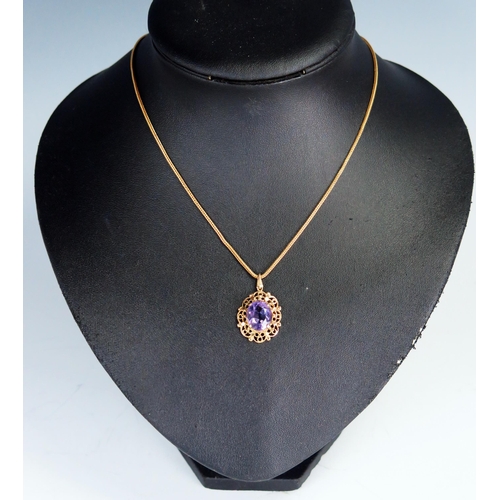 370 - 9ct Gold and Amethyst Pendant on chain, 29mm drop, 5.6g