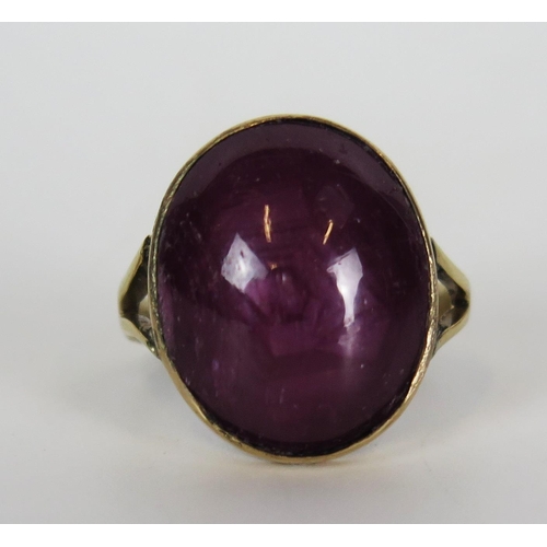 377 - Pink Star Sapphire Ring in a precious yellow metal setting, 18x15mm stone, size L.5, 7.1g. Shank rep... 