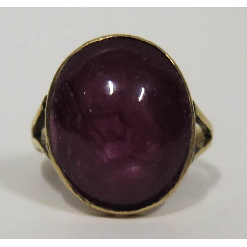 377 - Pink Star Sapphire Ring in a precious yellow metal setting, 18x15mm stone, size L.5, 7.1g. Shank rep... 