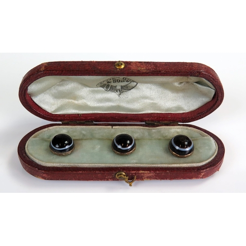 380 - Cased Set of Three Banded Agate Studs in unmarked gold setting, 4.8g