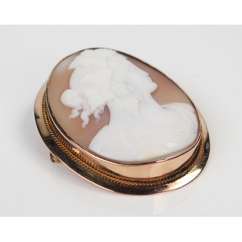 41 - 9ct Gold Shell Cameo Brooch decorated with a classical female bust, 47x38mm, 12.4g