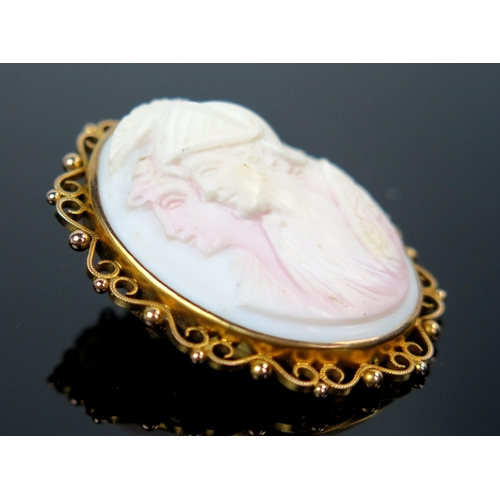 43 - 9ct Gold Shell Cameo Brooch decorated with twin classical busts, 47x37mm, 14.9g