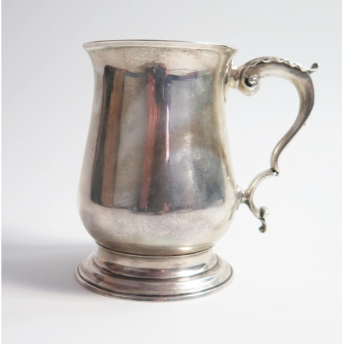 520 - A George III silver half pint mug, of plain baluster form, London 1766, John Perry, 11.5cm high 295.... 