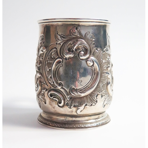 521 - A George II silver mug, of baluster form, later embossed decoration, London 1729, Matthew Lofthouse,... 